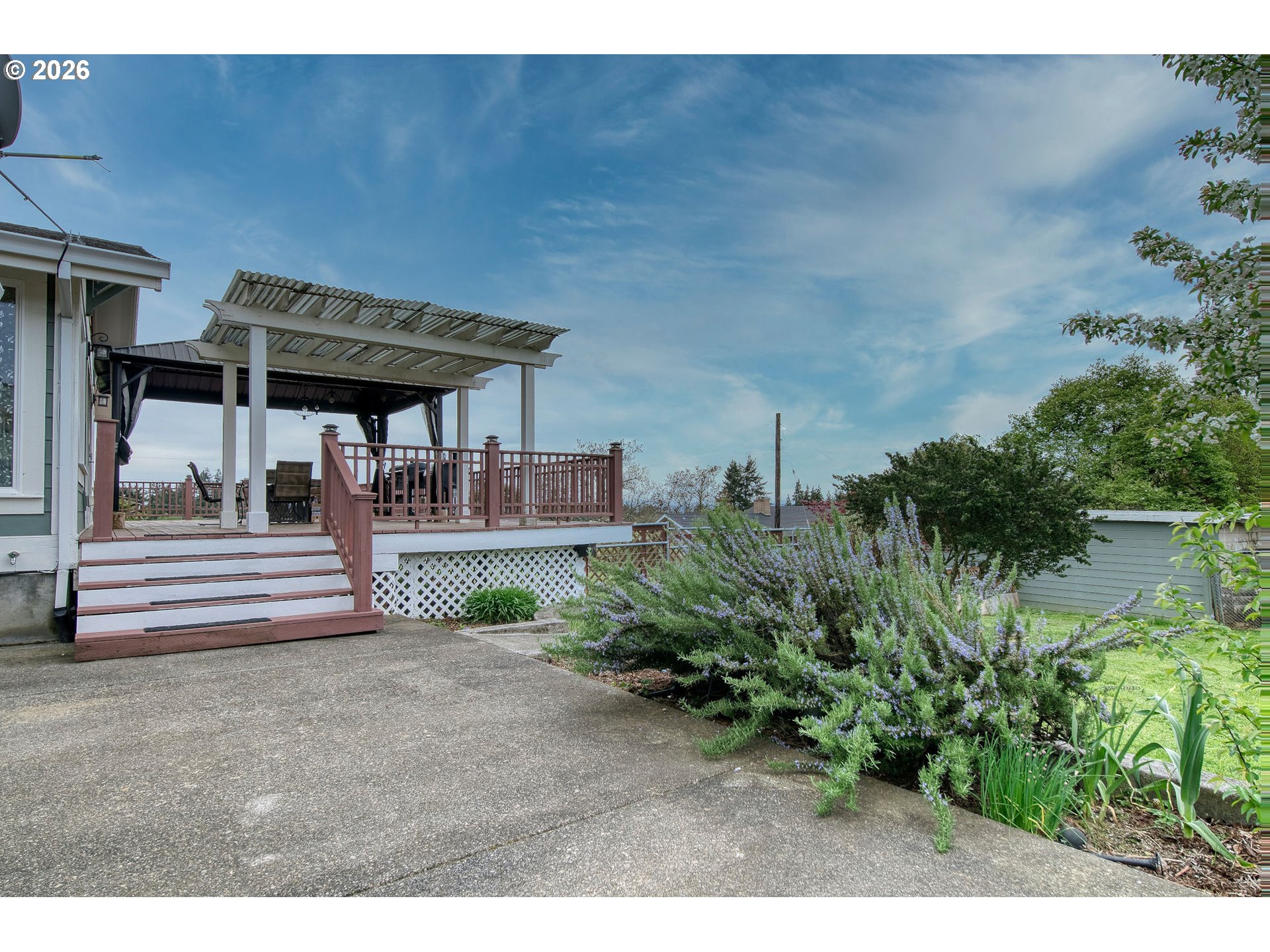 35432 Spence Street St. Helens, OR 97051 - Photo 39 of 48 a view of a patio with table and chairs potted plants and large tree