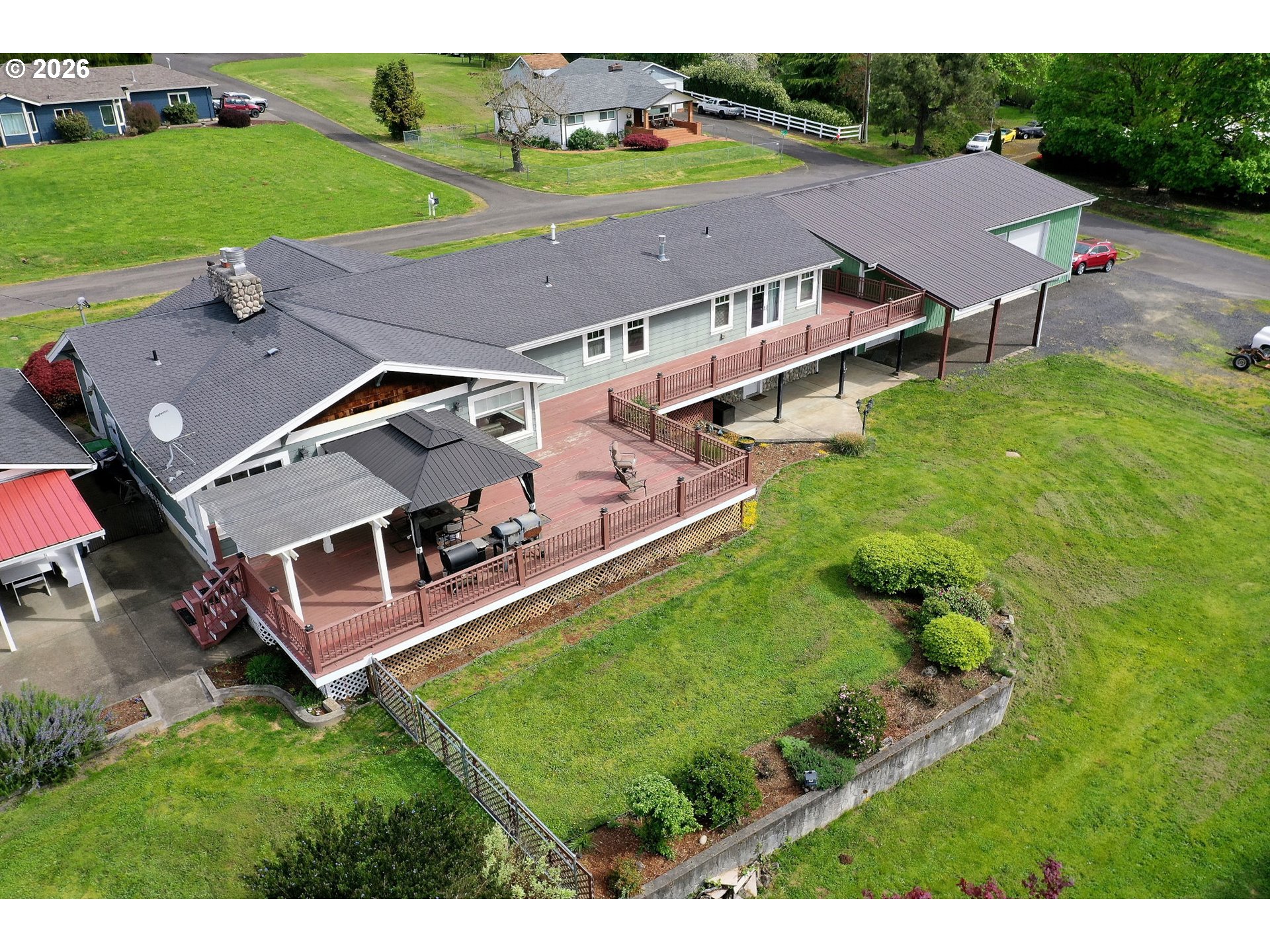 35432 Spence Street St. Helens, OR 97051 - Photo 45 of 48 an aerial view of a house with a garden and trees