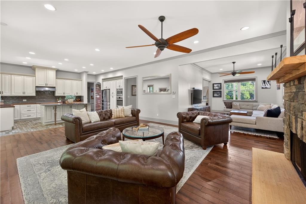 632 Geiger Road Jefferson, GA 30549 - Photo 17 of 55 a living room with furniture kitchen view and a wooden floor