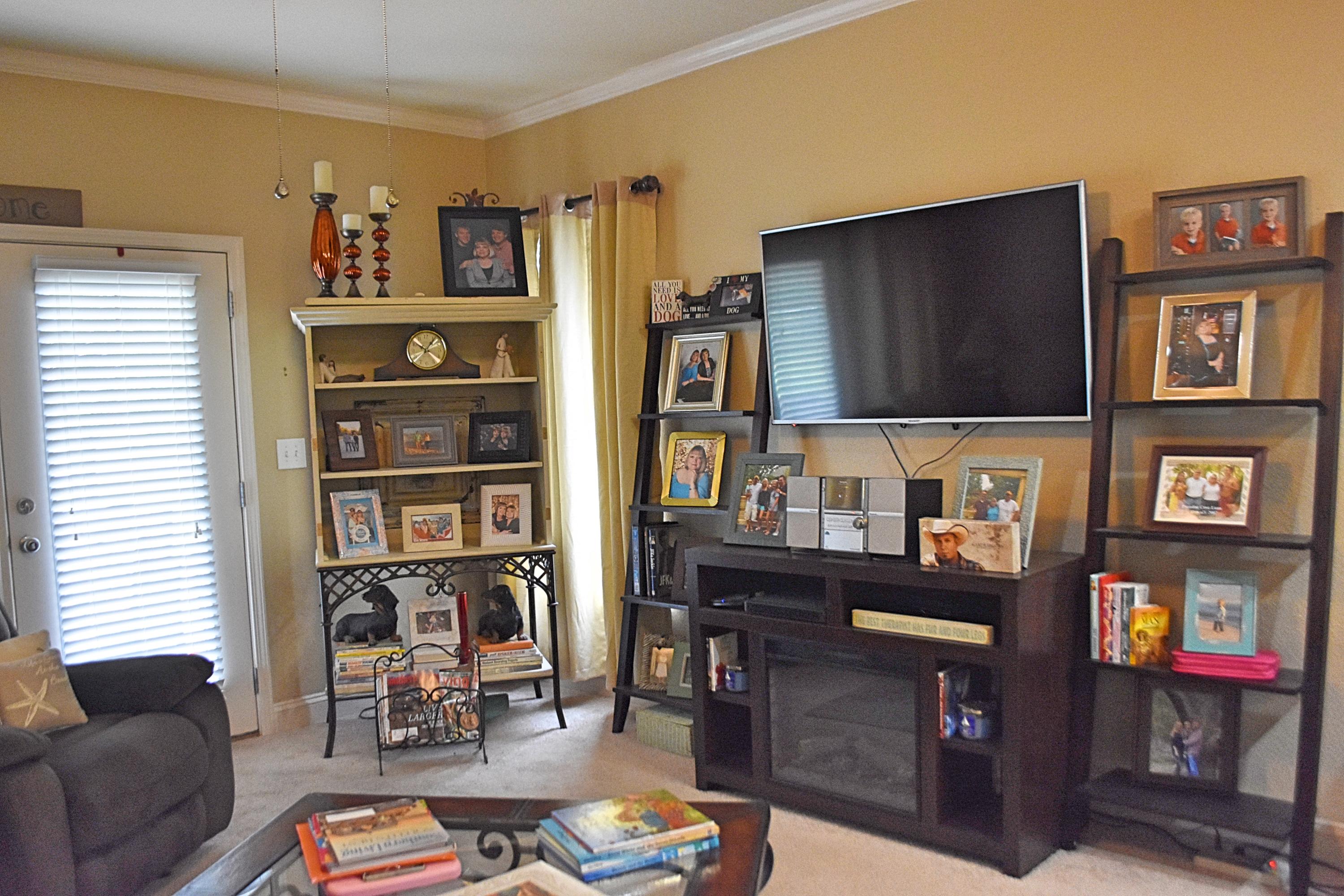 18 North Sand Palm Road, Unit 17 Freeport, FL 32439 - Photo 5 of 13 a living room with furniture and a flat screen tv