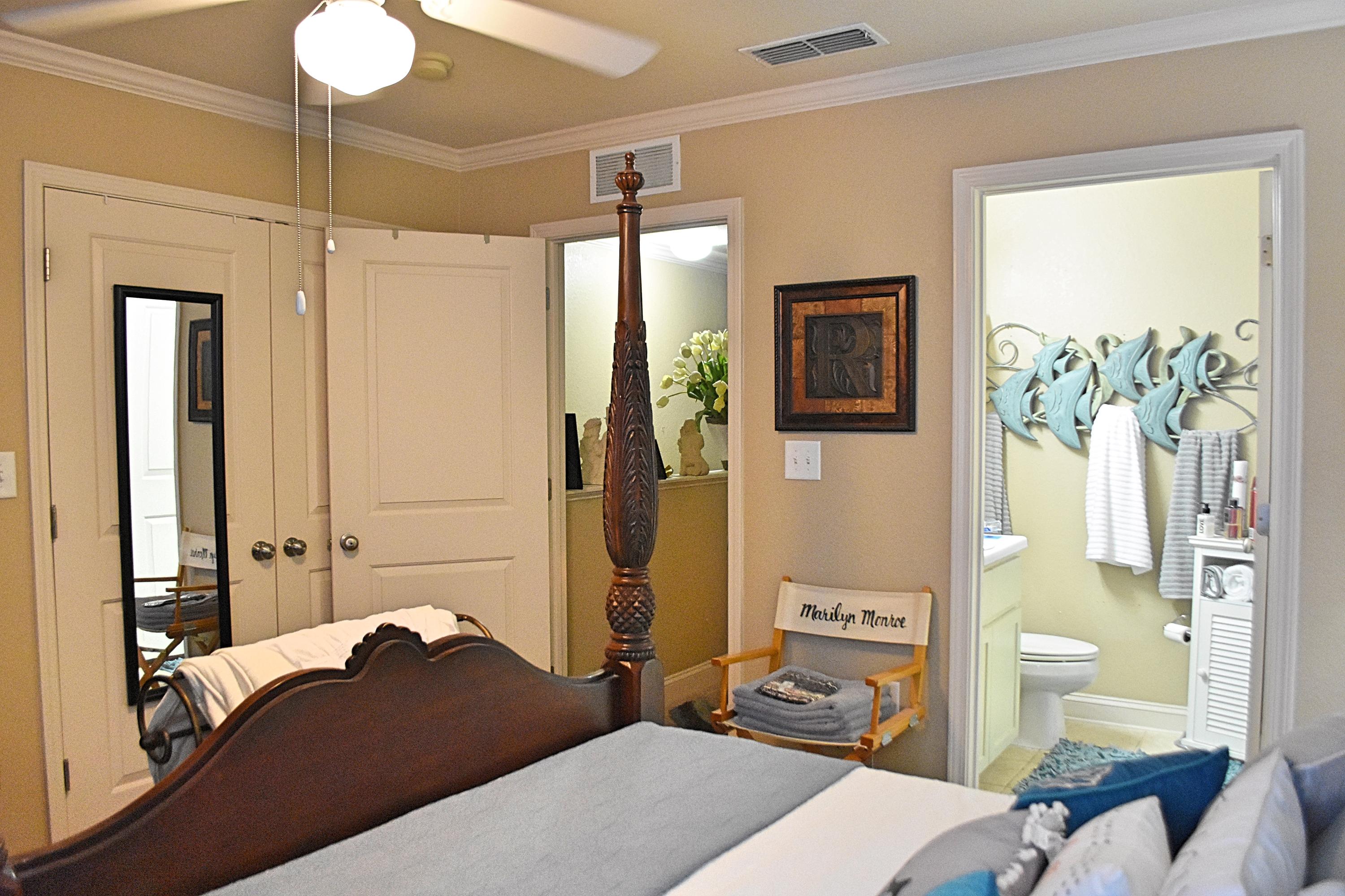 18 North Sand Palm Road, Unit 17 Freeport, FL 32439 - Photo 10 of 13 a bedroom with a bed and wooden floor