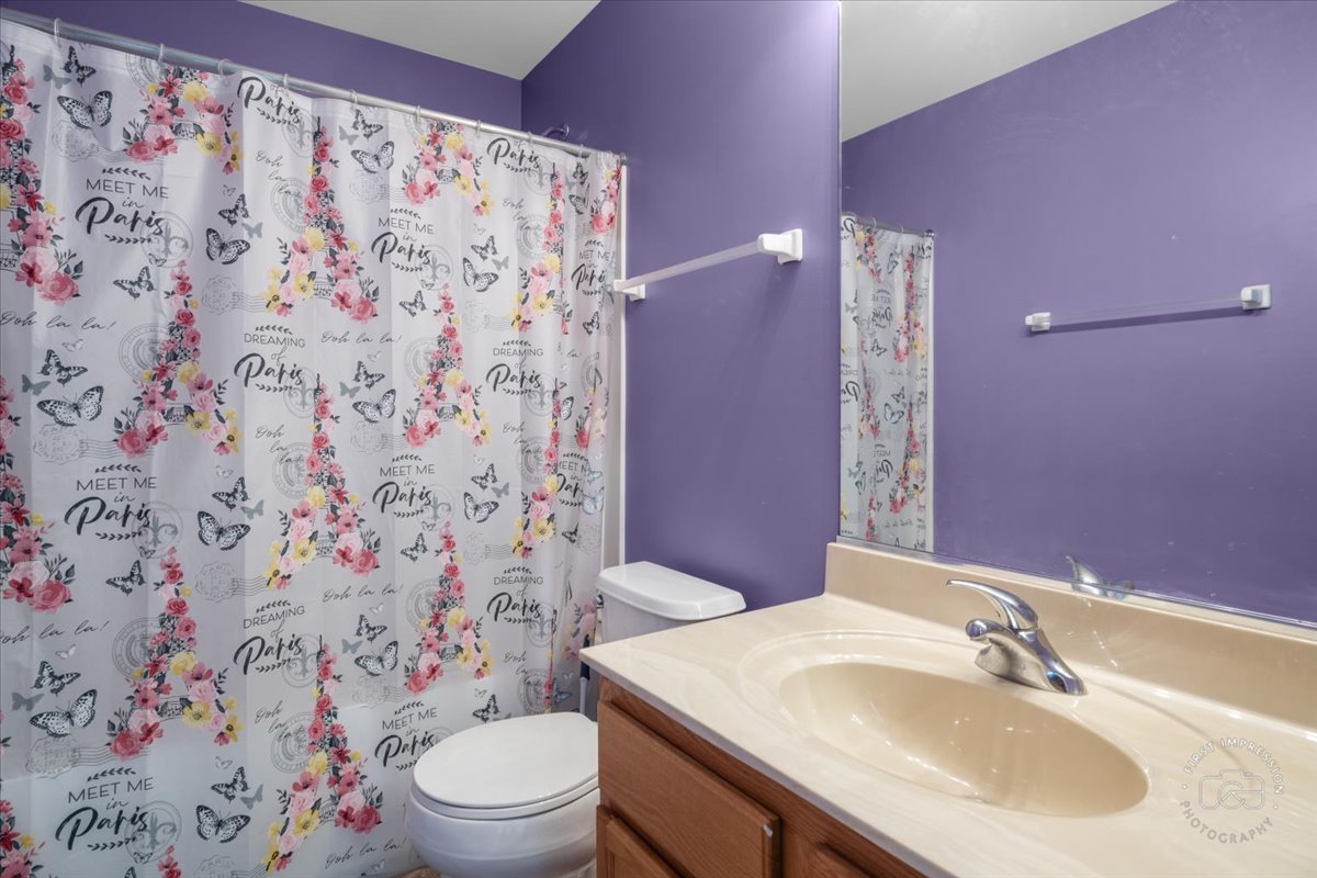 511 Silver Falls Street Joliet, IL 60431 - Photo 17 of 35 a bathroom with a sink toilet and shower
