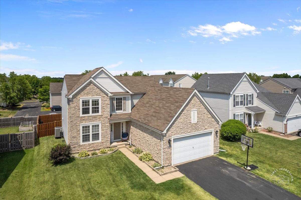 511 Silver Falls Street Joliet, IL 60431 - Photo 30 of 35 a view of a house with a yard