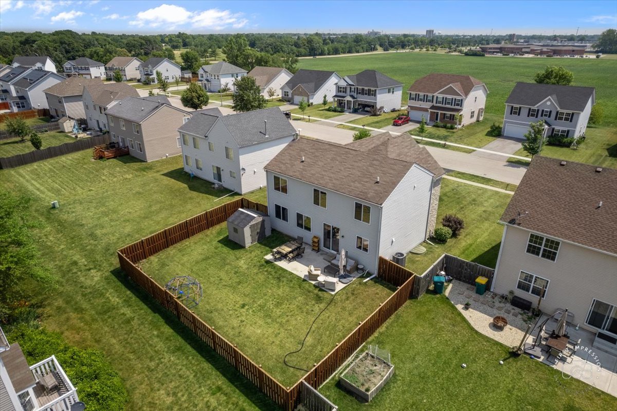 511 Silver Falls Street Joliet, IL 60431 - Photo 34 of 35 an aerial view of a house with pool big yard and large trees