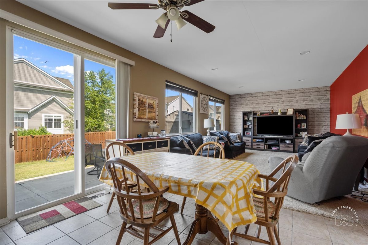 511 Silver Falls Street Joliet, IL 60431 - Photo 6 of 35 a view of a dining room with furniture window and outside view