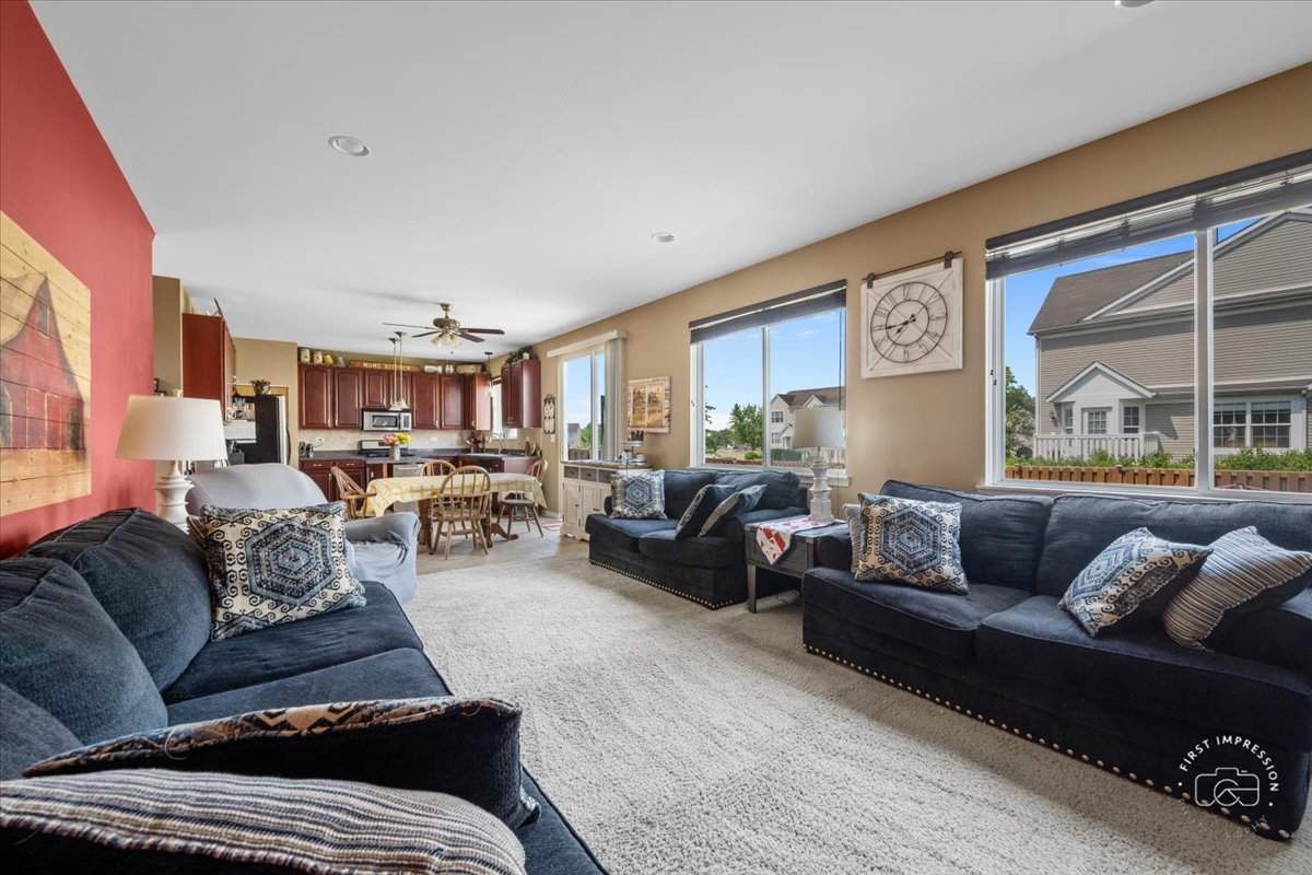 511 Silver Falls Street Joliet, IL 60431 - Photo 8 of 35 a living room with furniture and a large window