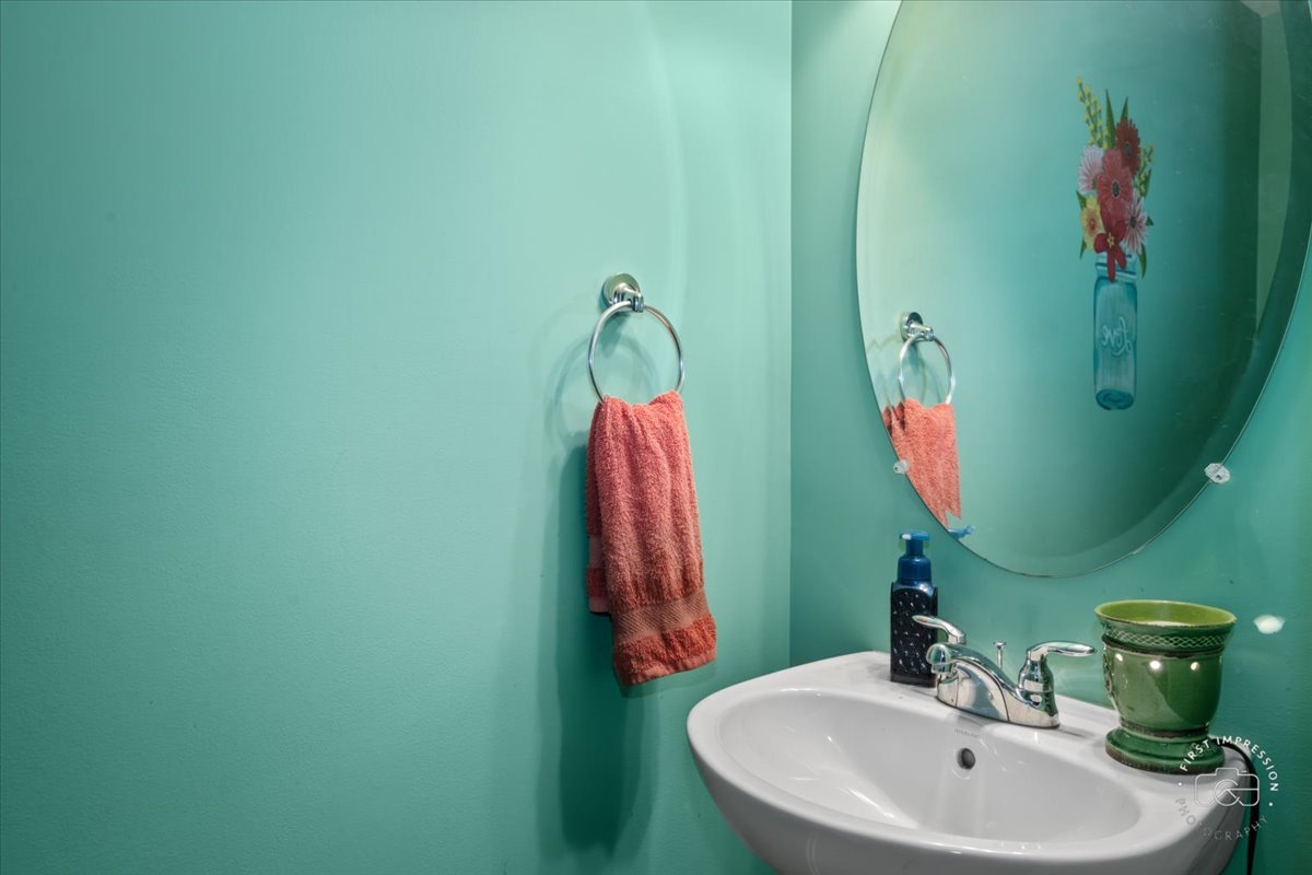 511 Silver Falls Street Joliet, IL 60431 - Photo 10 of 35 a bathroom with a sink and a mirror