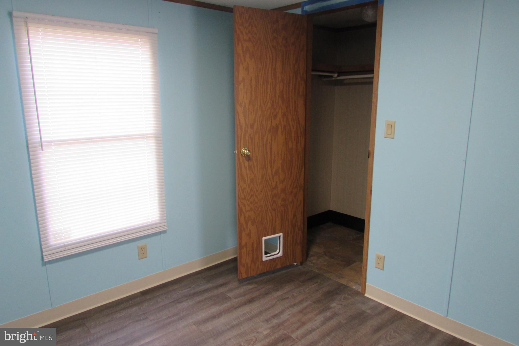 12222 Polktown Road Waynesboro, PA 17268 - Photo 12 of 22 a view of an empty room with wooden floor and a window