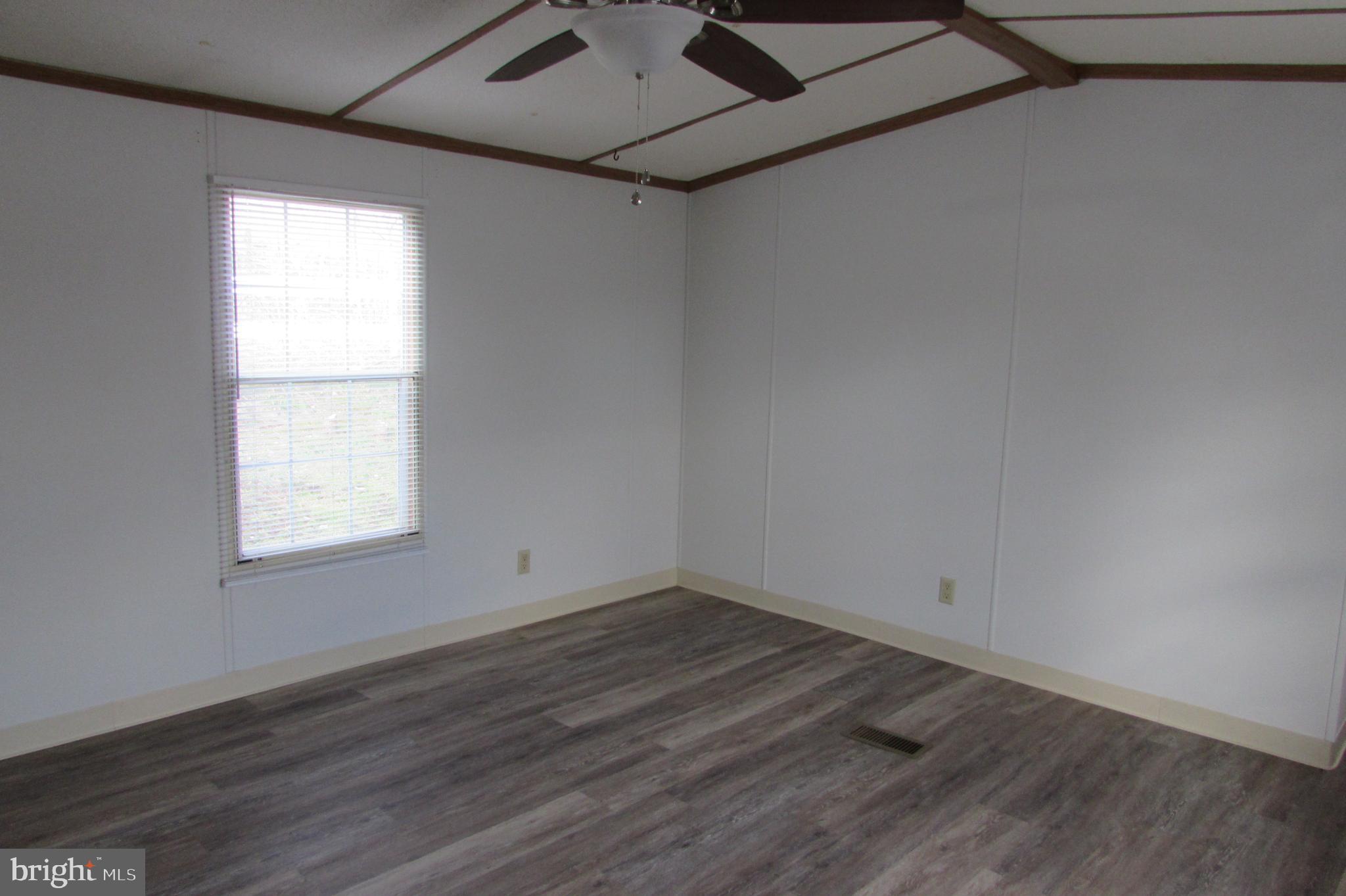 12222 Polktown Road Waynesboro, PA 17268 - Photo 6 of 22 an empty room with wooden floor and windows