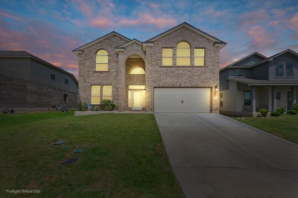 3220 Marston Road Lorena, TX 76655 - Photo 1 of 40 a front view of a house with a garden and yard
