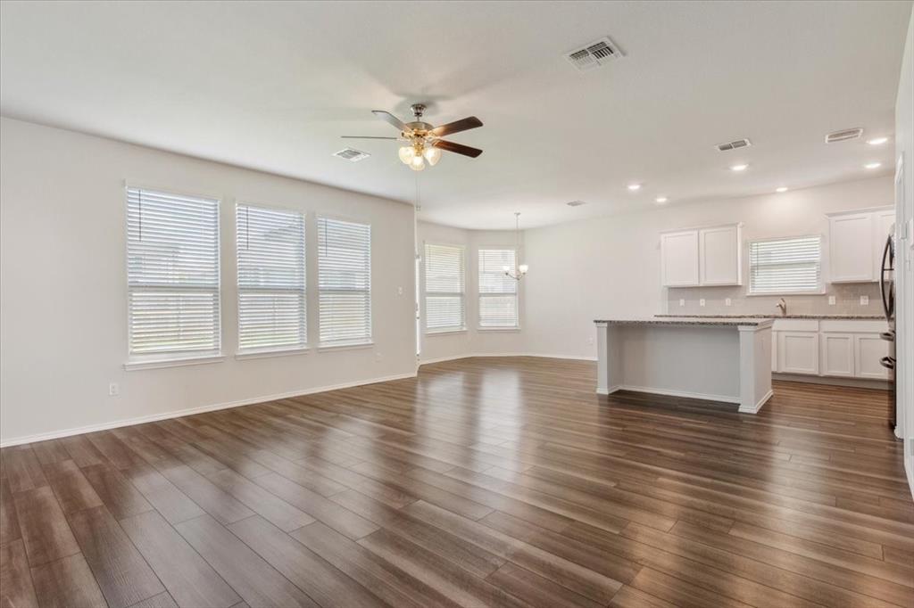 3220 Marston Road Lorena, TX 76655 - Photo 11 of 40 a view of an empty room with wooden floor and a window