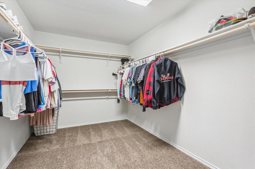 3220 Marston Road Lorena, TX 76655 - Photo 23 of 40 a view of walk in closet with clothes and shoes