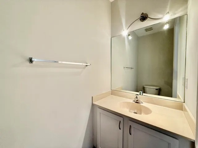 a bathroom with a sink and mirror