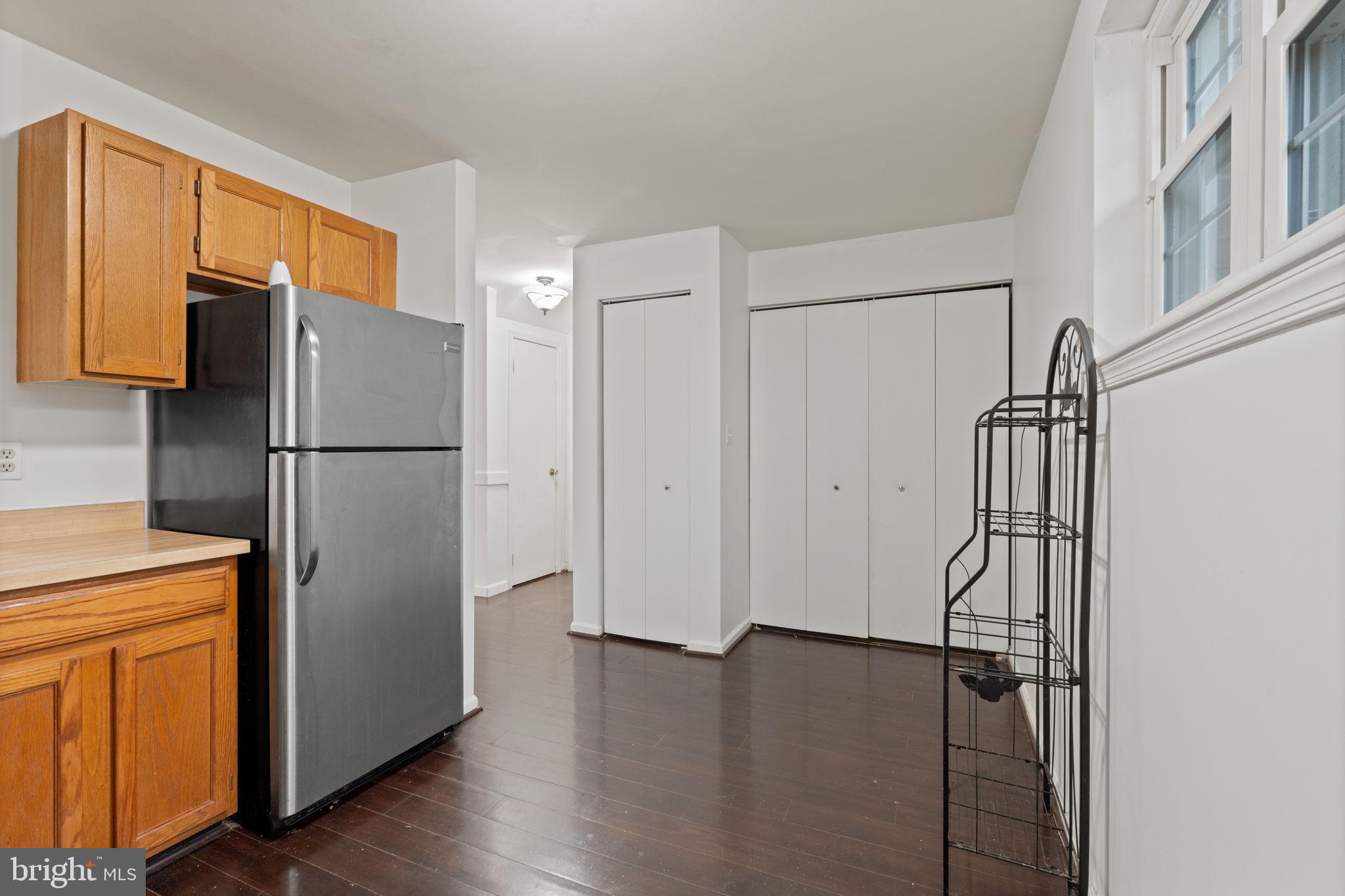 4209 Stockbridge Drive Dumfries, VA 22025 - Photo 20 of 26 a view of a kitchen with wooden floor and a refrigerator