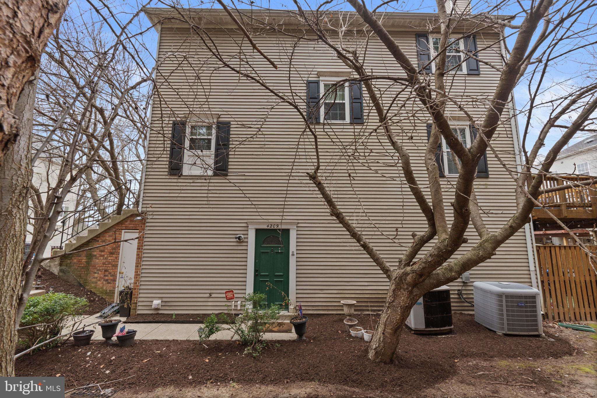 4209 Stockbridge Drive Dumfries, VA 22025 - Photo 25 of 26 a view of a house with a yard
