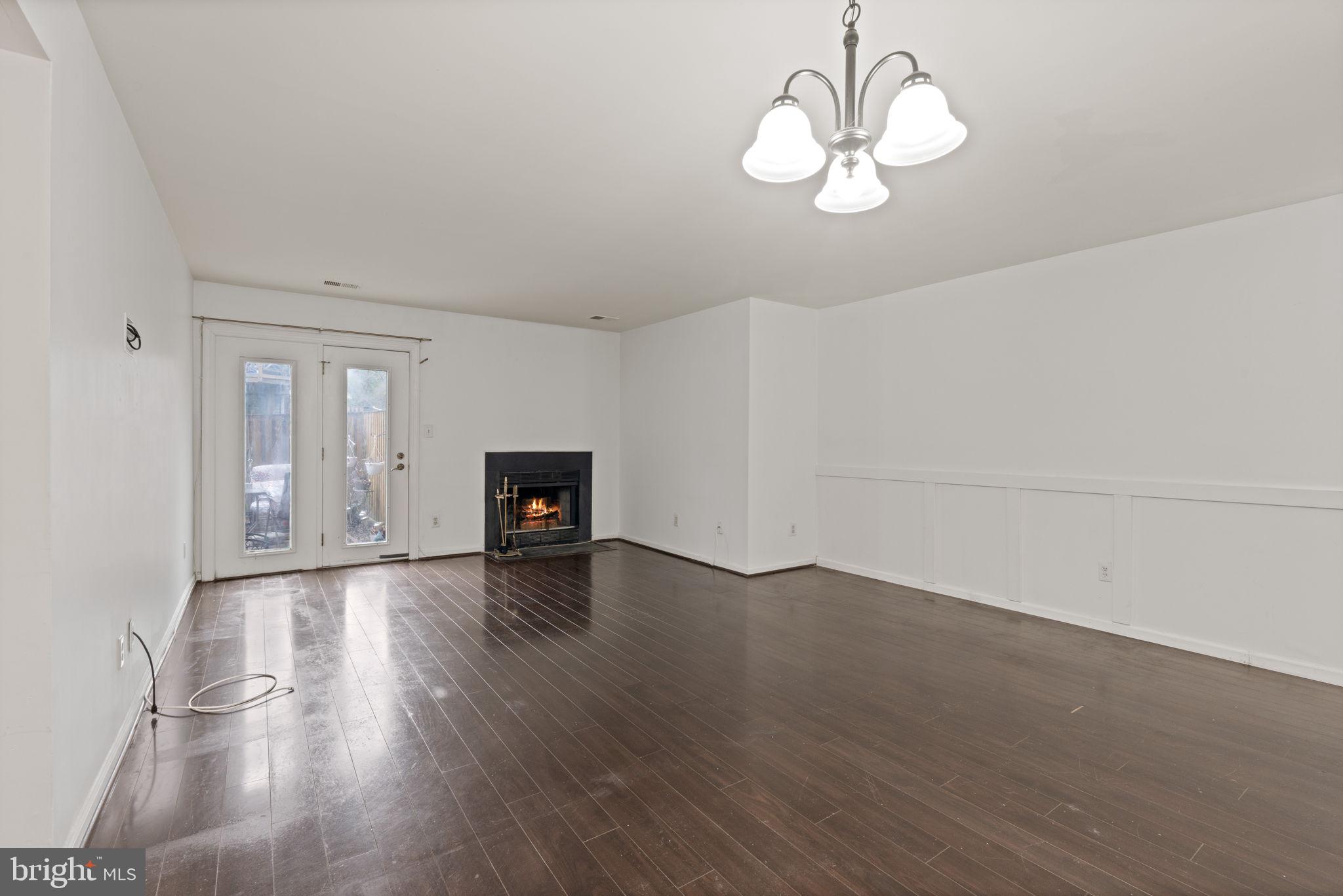 4209 Stockbridge Drive Dumfries, VA 22025 - Photo 6 of 26 a view of empty room with wooden floor and ceiling fan