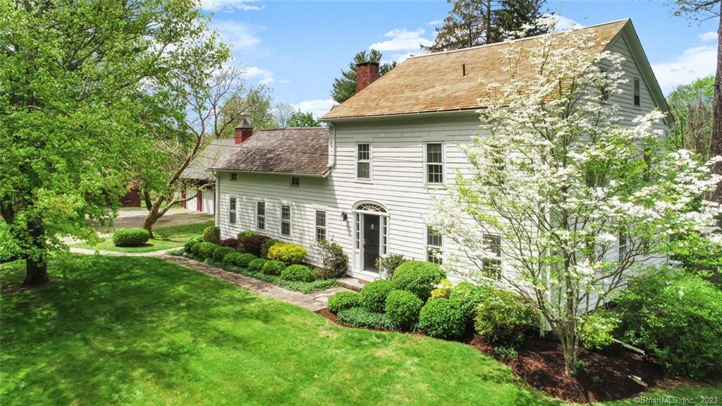 136 Castle Hill Road Newtown, CT 06470 - Photo 1 of 1 a view of a house with a yard