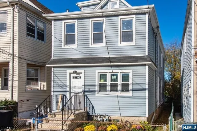 a view of a house with more windows and potted plants