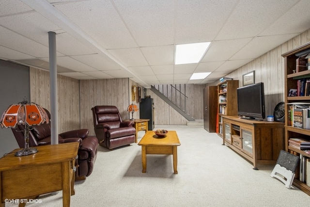 9003 Krunfus Road Harvard, IL 60033 - Photo 14 of 16 a living room with furniture and a flat screen tv