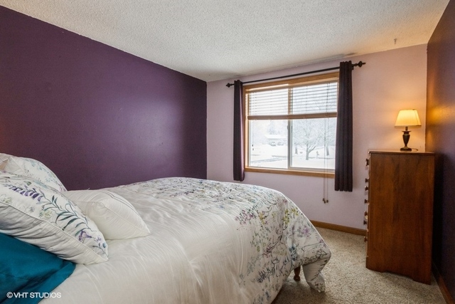 9003 Krunfus Road Harvard, IL 60033 - Photo 8 of 16 a bedroom with a bed and a window