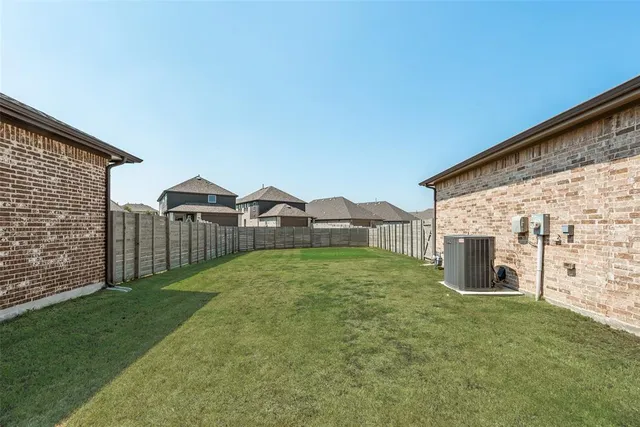 a view of a back yard of the house