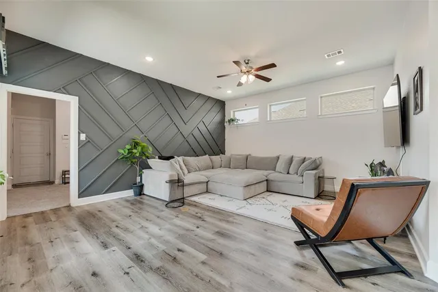 a living room with furniture and a rug