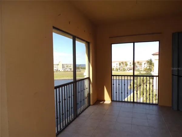 a view of a room with large windows
