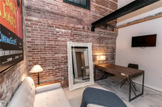 a view of a livingroom with furniture and wooden floor