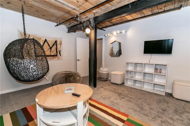 a room with wooden furniture and a fireplace