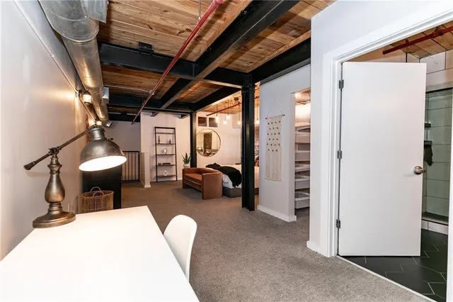 a bed room with a bed window and a couch