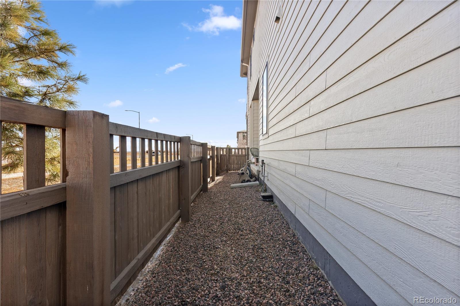 6058 North Perth Street Aurora, CO 80019 - Photo 21 of 47 a view of a pathway of a building