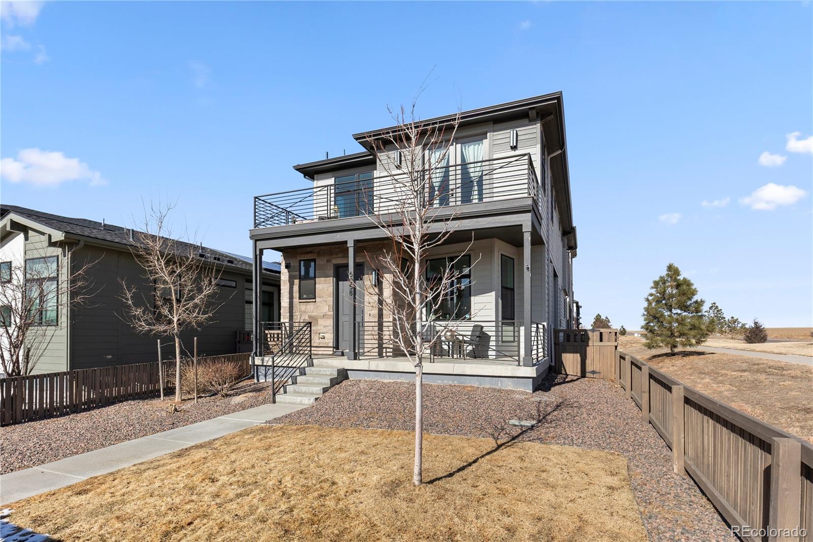 6058 North Perth Street Aurora, CO 80019 - Photo 3 of 47 a view of a house with wooden fence