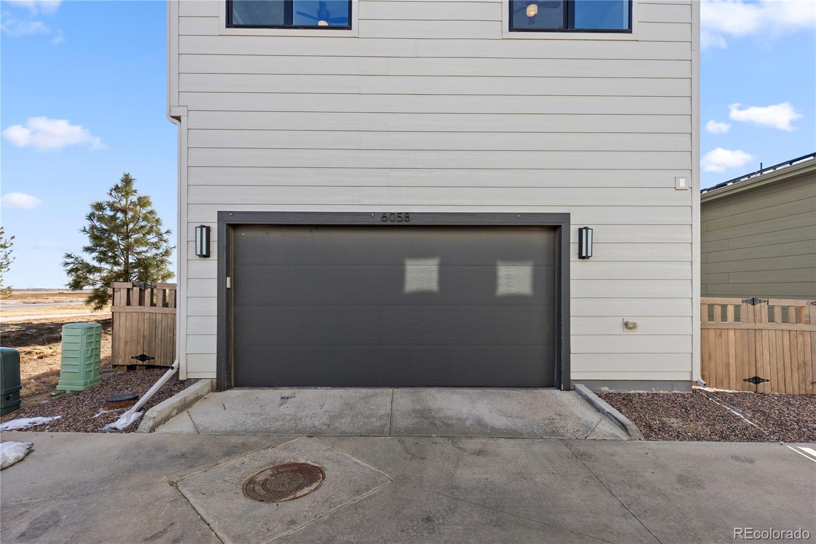 6058 North Perth Street Aurora, CO 80019 - Photo 43 of 47 a view of a front door and a garage