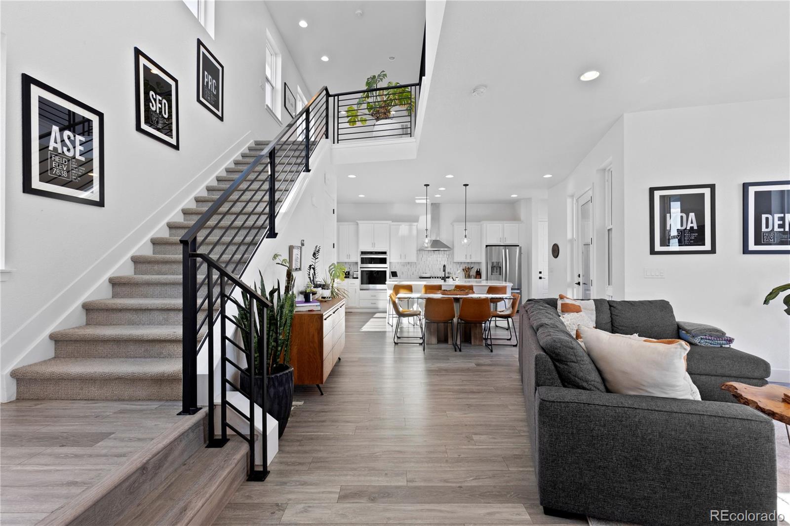 6058 North Perth Street Aurora, CO 80019 - Photo 5 of 47 a living room with furniture and wooden floor