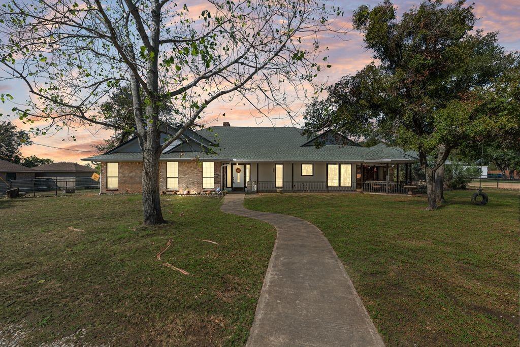 83 Crown Road Willow Park, TX 76087 - Photo 33 of 35 Brick exterior with a green shingle roof