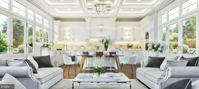 a living room with furniture large windows and wooden floor