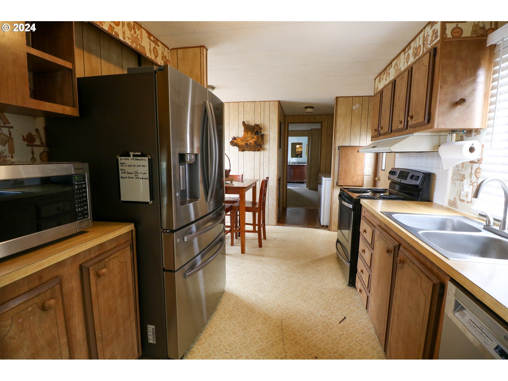 1265 Embarcadero Circle Coos Bay, OR 97420 - Photo 11 of 36 a kitchen with a refrigerator and a sink