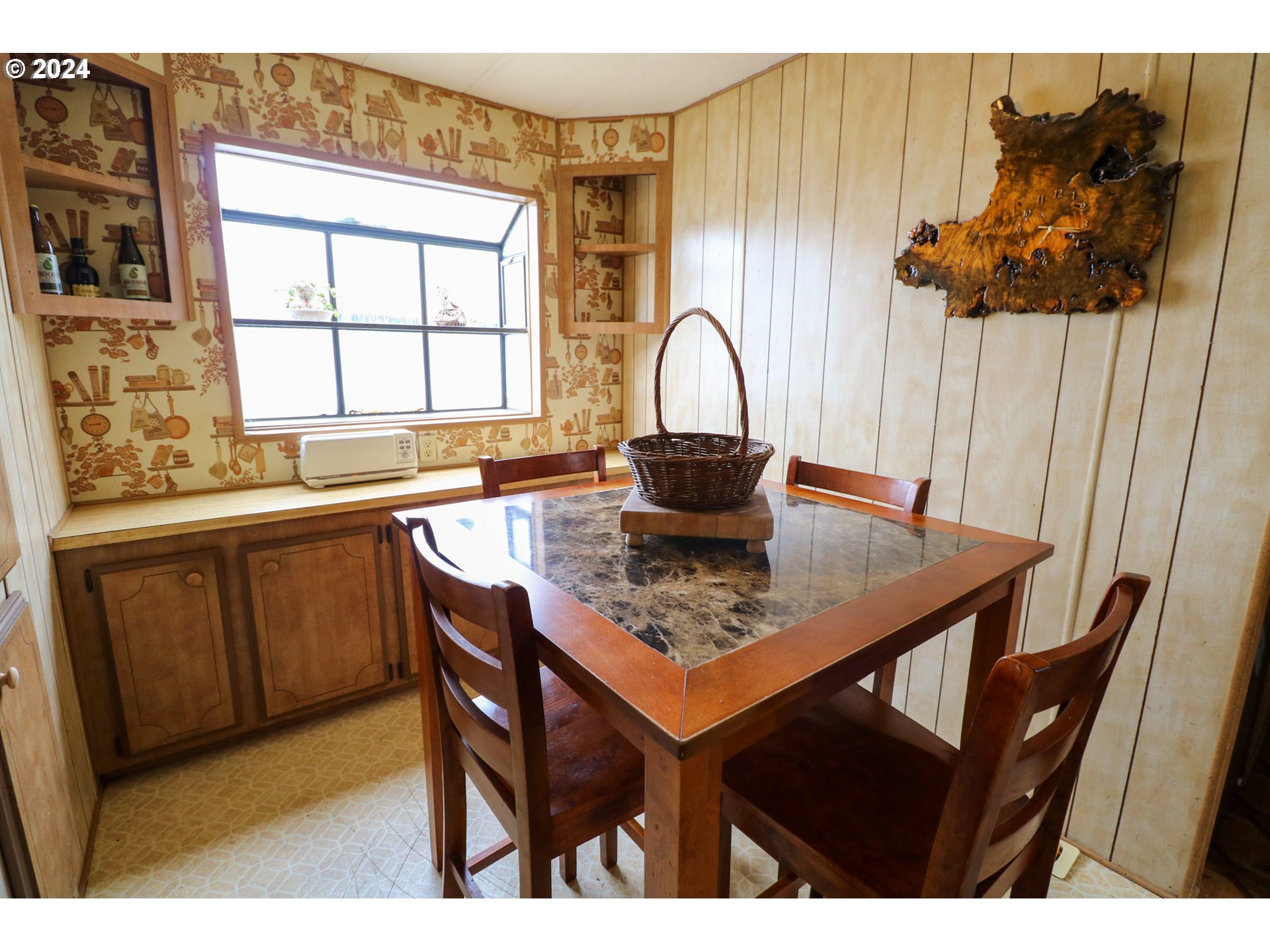 1265 Embarcadero Circle Coos Bay, OR 97420 - Photo 14 of 36 a kitchen with a wooden table and chairs