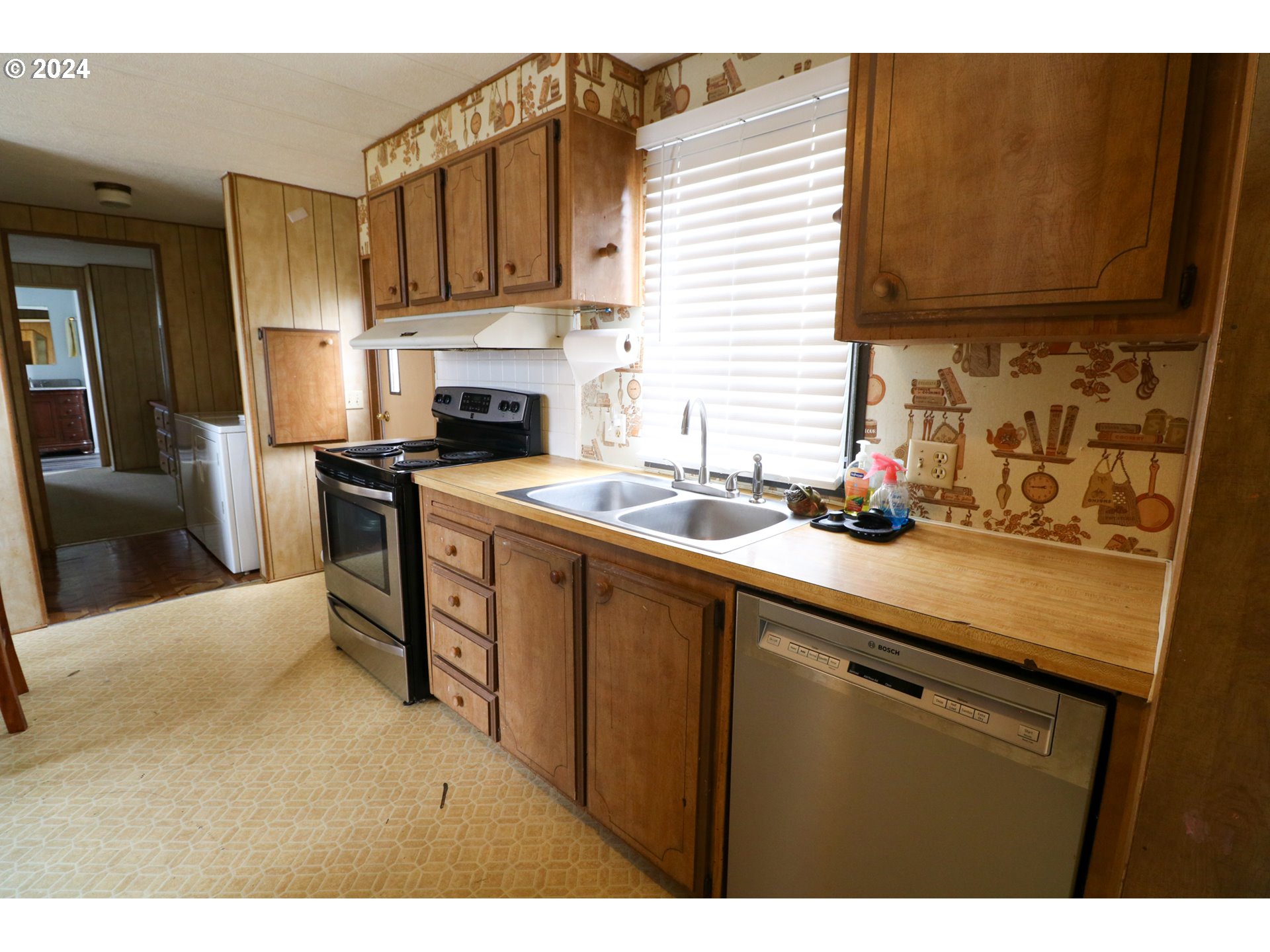 1265 Embarcadero Circle Coos Bay, OR 97420 - Photo 16 of 36 a kitchen with a sink cabinets and appliances