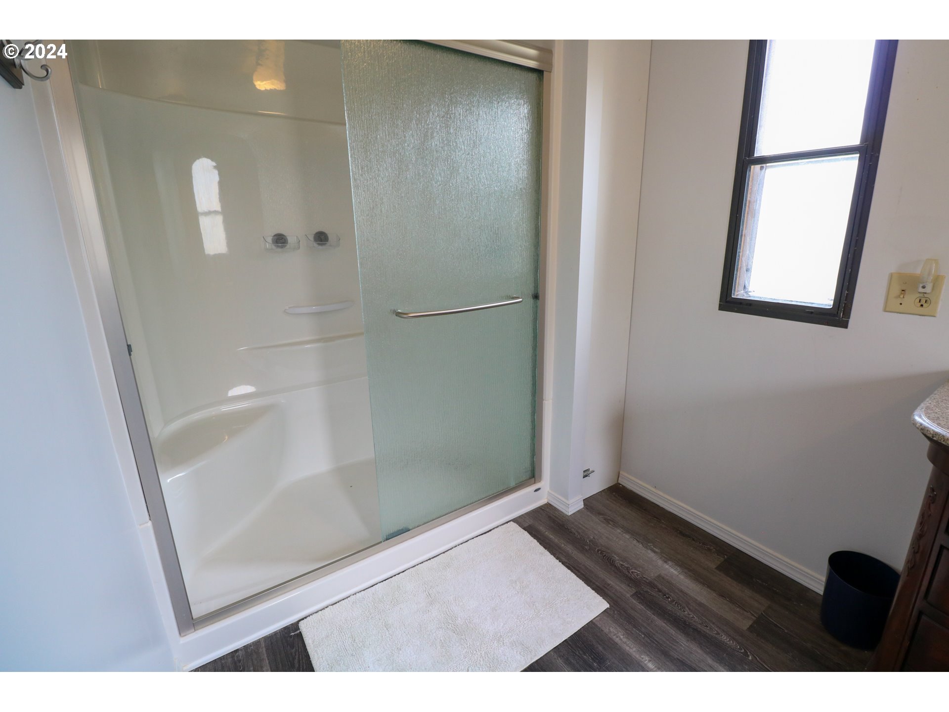 1265 Embarcadero Circle Coos Bay, OR 97420 - Photo 21 of 36 a bathroom with a glass shower door