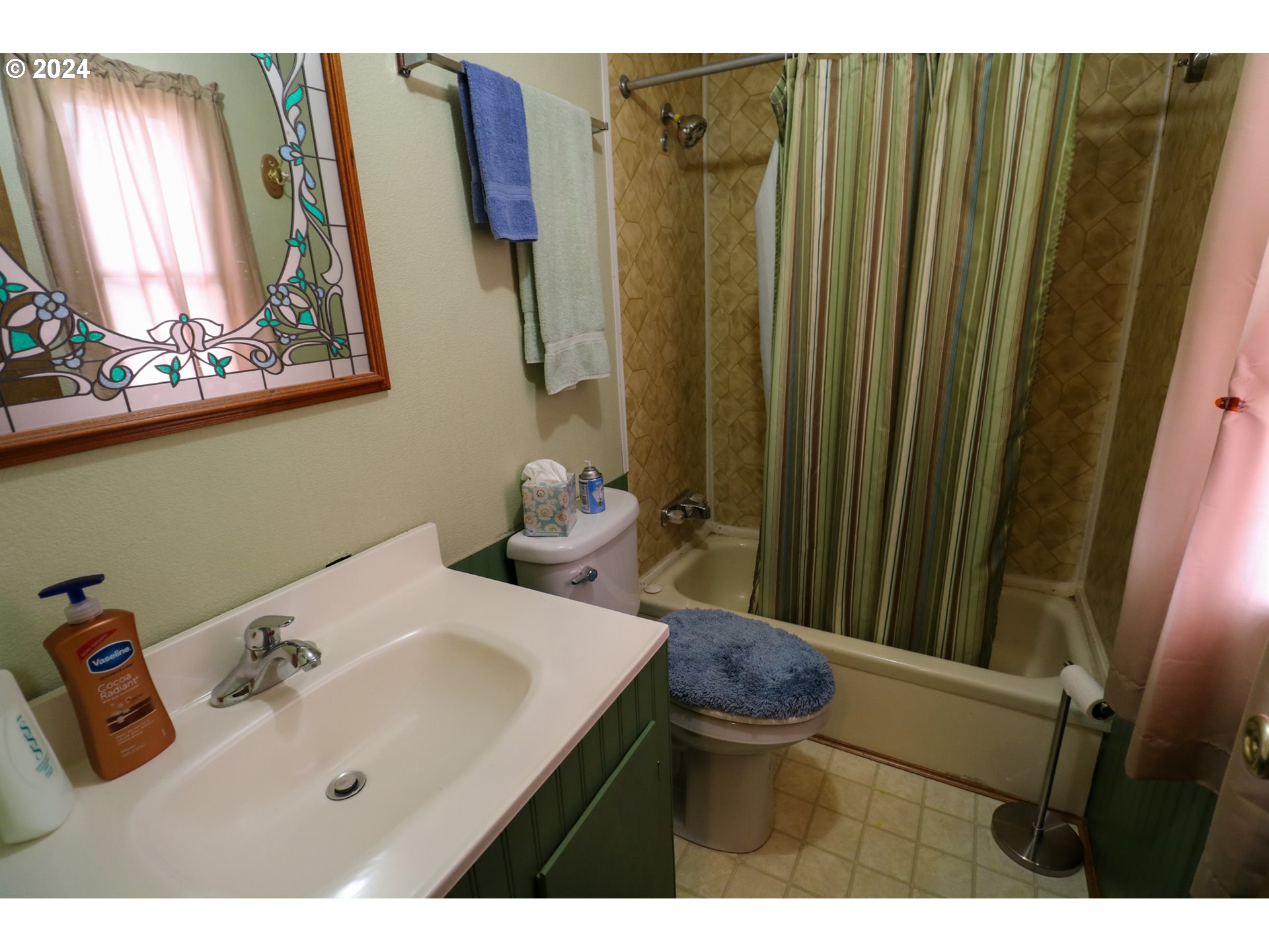 1265 Embarcadero Circle Coos Bay, OR 97420 - Photo 24 of 36 a bathroom with a sink and a mirror