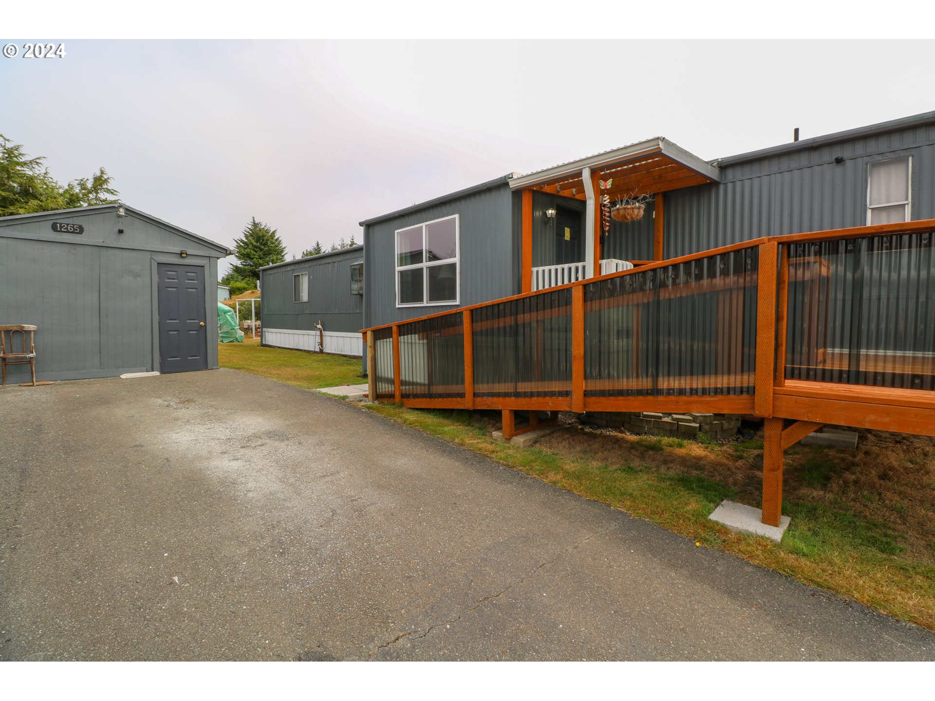 1265 Embarcadero Circle Coos Bay, OR 97420 - Photo 29 of 36 a view of a house with a park