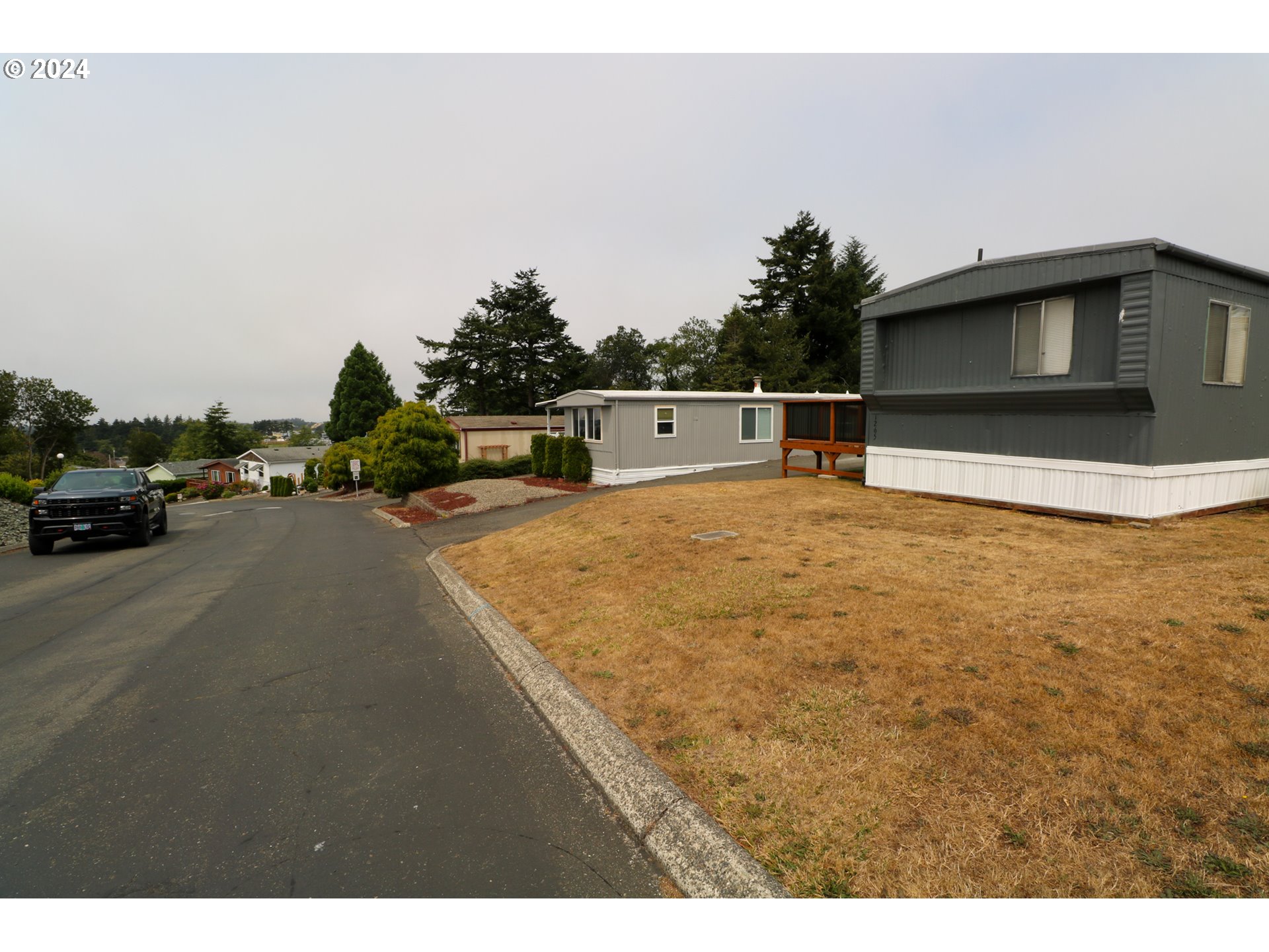 1265 Embarcadero Circle Coos Bay, OR 97420 - Photo 31 of 36 a view of parking area