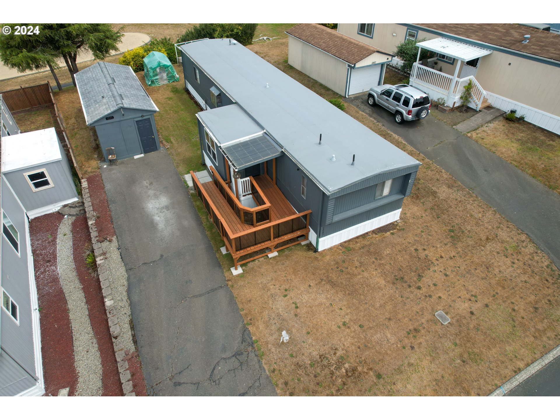 1265 Embarcadero Circle Coos Bay, OR 97420 - Photo 32 of 36 an aerial view of residential houses with outdoor space