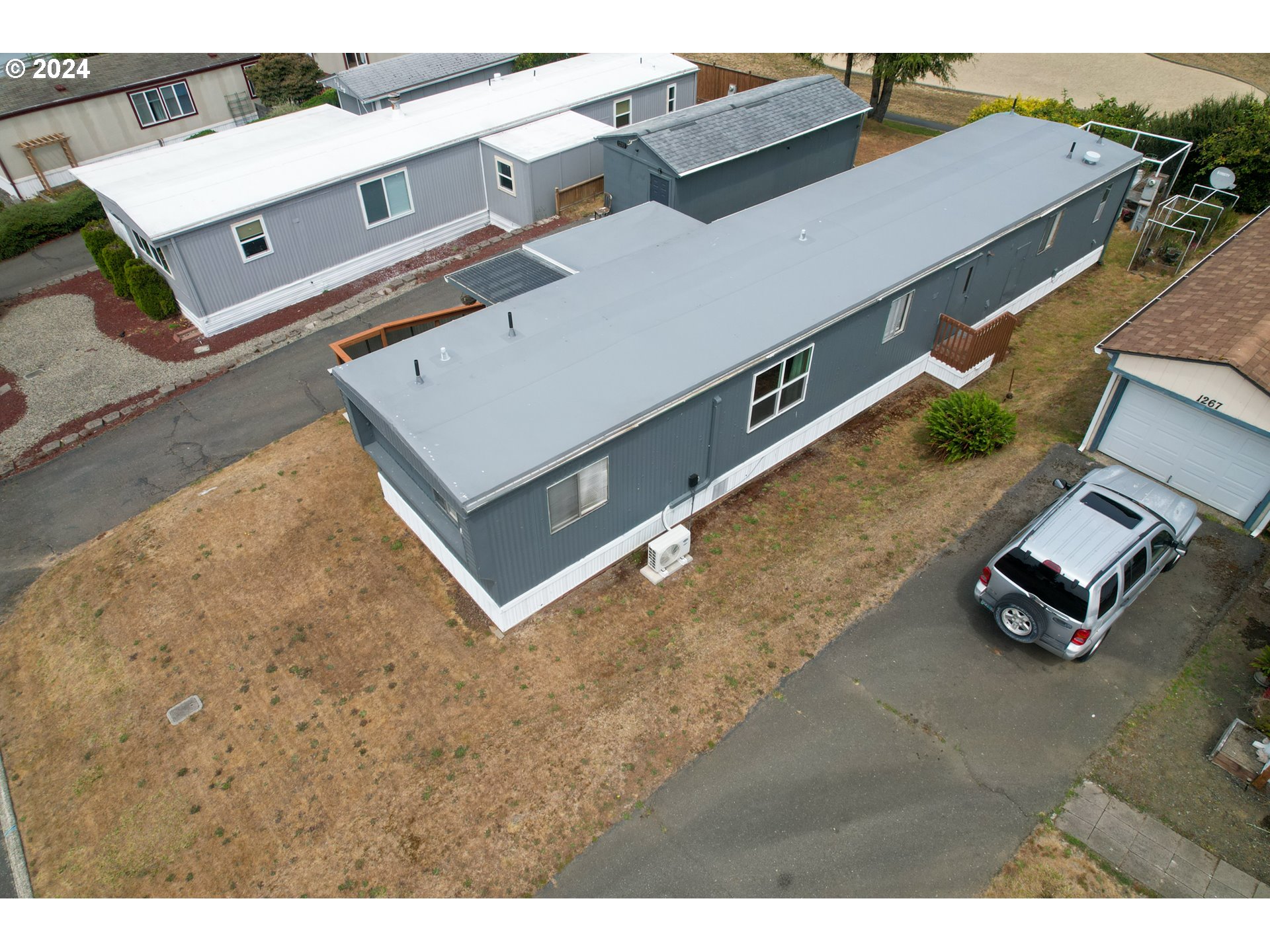 1265 Embarcadero Circle Coos Bay, OR 97420 - Photo 33 of 36 an aerial view of residential houses with outdoor space