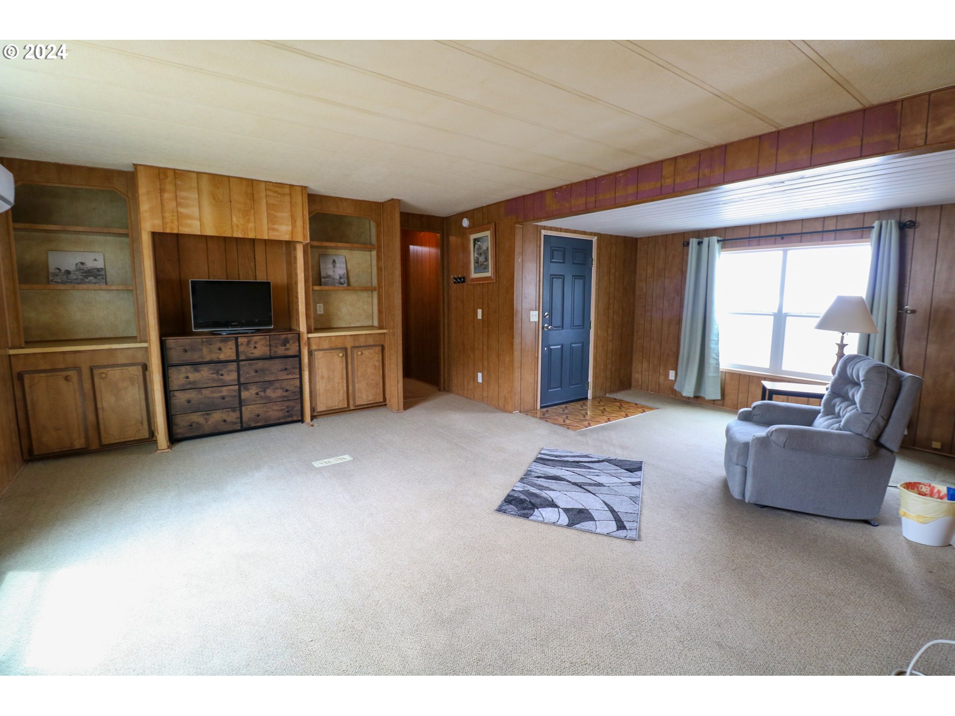 1265 Embarcadero Circle Coos Bay, OR 97420 - Photo 6 of 36 a living room with furniture and a flat screen tv