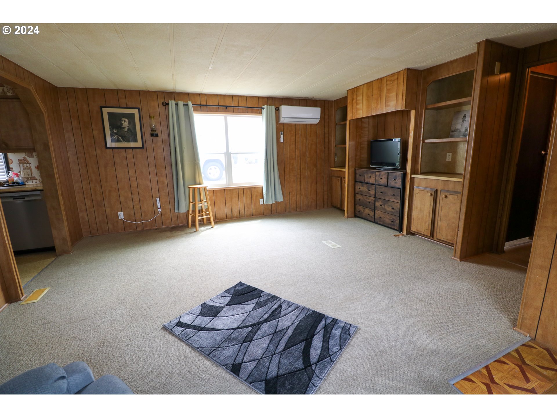 1265 Embarcadero Circle Coos Bay, OR 97420 - Photo 7 of 36 a living room with furniture and a flat screen tv