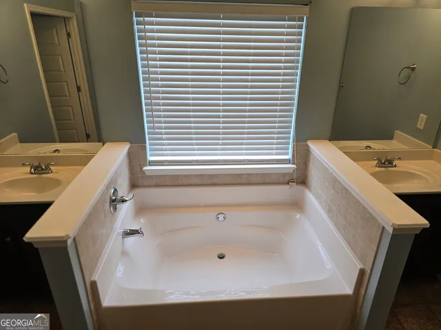 a bathroom with a sink and a bathtub