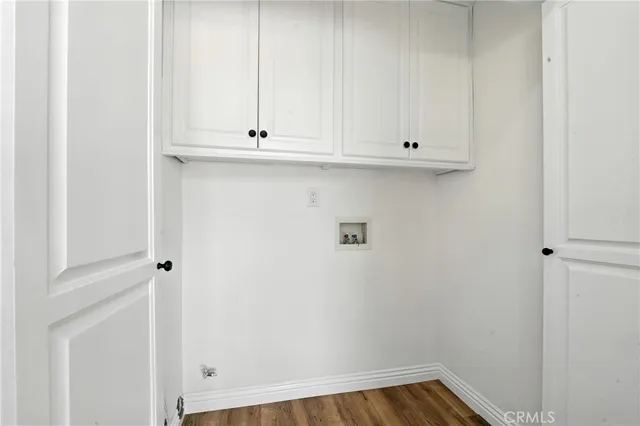a view of cabinets and wooden floor