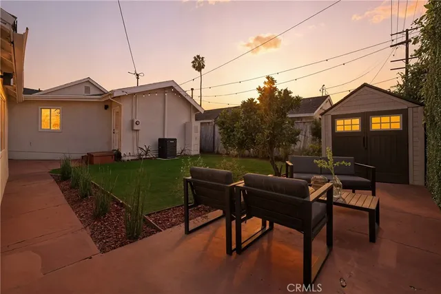 a view of a house with a yard porch and sitting area